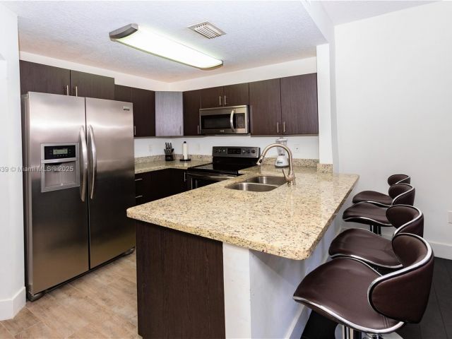 Дом в аренду по адресу 6202 NW 116th Ave 449 - фото 7437611