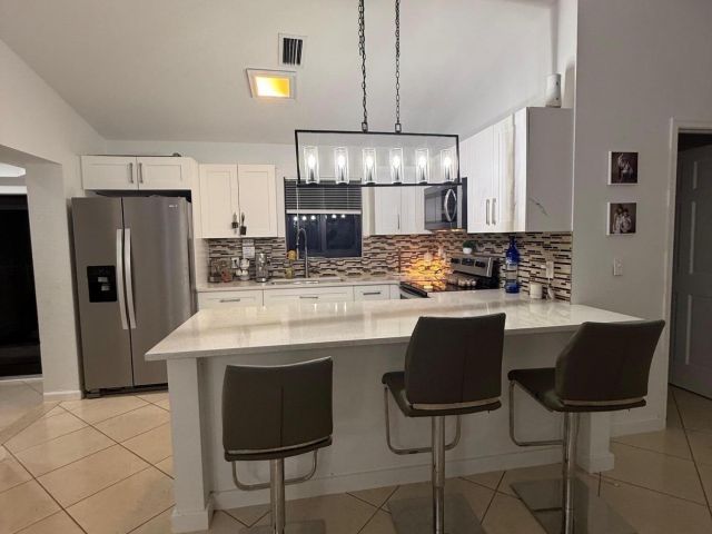 Дом в аренду по адресу 13530 52nd Court N - фото 6628540