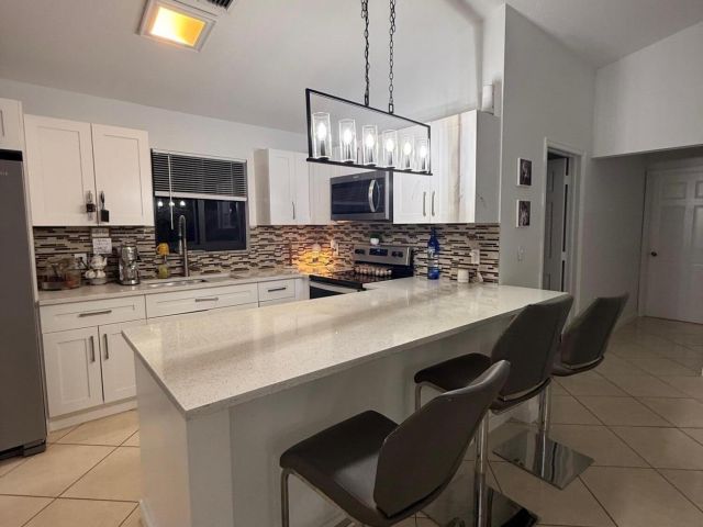 Дом в аренду по адресу 13530 52nd Court N - фото 6628541