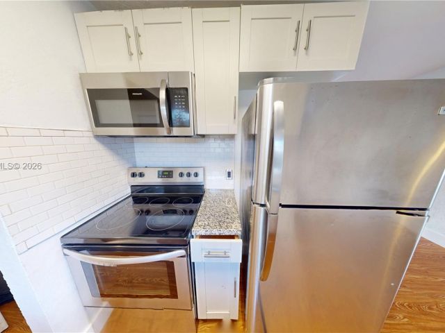 Дом в аренду по адресу 404 NW 21st Ter - фото 7496884