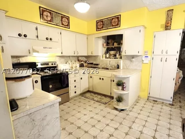 Продажа дома по адресу 8210 NW 34th Ave - фото 9389517